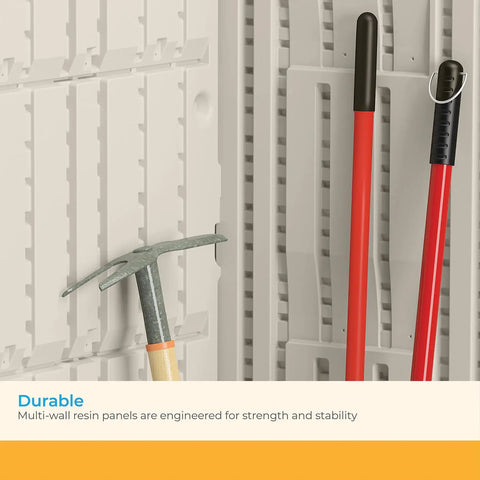 Interior of vertical outdoor storage shed with hooks holding long-handled tools, showcasing all-weather construction and stability.
