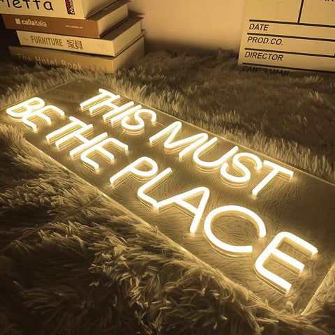 Custom Wall Neon Sign For Home Decor Pink LED Neon Light Dope Party Vibe For Bachelorette Party Birthday Wedding Engagement Bar Club Wall Hanging Warm White Glow Gift For Couples shown on carpet with text 'This Must Be The Place'