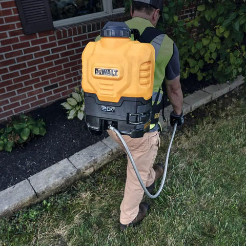 Man using 20V Max 4 Gallon Lithium Ion Cordless Backpack Sprayer Kit With 2Ah Battery, Heavy Duty Hose for lawn care