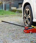 Beefy Floor Jack Handle Replacement For 3 Ton Horizontal Hydraulic Jacks Steel And Rubber Construction Durable Auto Repair Accessory Easy Fit Pole Lever in use lifting a car