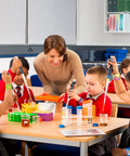 Children in classroom wearing 48 Piece Epic Science Slap Bracelets Party Favors Set For Science Week Classroom Fun Chemistry Biology Physics Lab Decor
