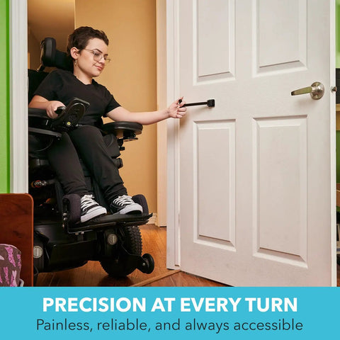 Person using accessible TPull door closer with easy grip swiveling handle on interior door, promoting pain-free operation.