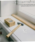 Hydrogen Oxygen Therapy Flow Valve For Home Wellness Gear on windowsill, with cardboard box and hammer nearby.