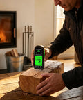 Pin Type Wood Moisture Meter With Hold Function 12mm Probes Big Backlit LCD Screen And Three Color LED Bar Graph For Easy Accurate Wood Moisture Readouts Ideal For DIY Carpentry And Home Renovation Projects. Measuring a wood log by fireplace