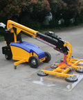 Electric Vacuum Glass Lifter With Hydraulic Arm 300 To 500 Kg Capacity Workhorse Grade Sheet Hoist Machine positioned beside glass panel.