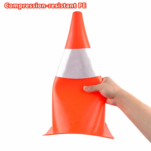 Hand bending a Top Notch High Visibility 15 Inch Traffic Cone with Reflective Collars showing compression-resistant design.