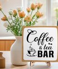 Rustic Coffee And Tea Bar Decor Sign Dope Wooden Plaque For Cafe Bar Or Coffee Station Or Shelf Farmhouse Kitchen Vibe And Tea Accessories For Home Or Office 5.9 By 5.9 Inches White And Brown displayed on a table with flowers in the background.