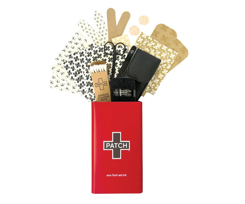 Front view of Patch eco first-aid kit in a red tin with white cross logo, containing assorted bandages and supplies