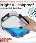 Hand holding square borosilicate glass food storage container with blue liquid, demonstrating airtight and leakproof lid.