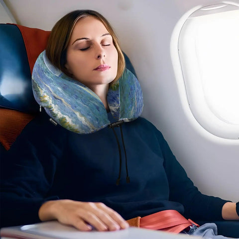 Woman using Monet's Sea Sailboat Travel Neck Pillow With Memory Foam For Naps In Plane, Car Or Office on airplane seat