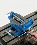 6 Inch Cross Slide Drill Press Vise Built Like A Tank With Nine Point Four In X Axis Travel And Eight In Y Motion shown in use on machinery.