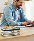 Man working on laptop with Desert Insulated Lunch Bag Leakproof Cooler on table, size 10 by 6.1 by 3.5 inches.