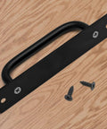 Black Barn Door Handle Set 2 Pack With 128mm Hole Center Sliding Cabinet Pulls and screws on a wooden surface