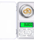Pocket Milligram Scale With 50G Capacity And 0.001G Resolution Digital LCD Display showing gold rings being weighed