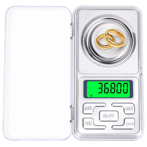 Pocket Milligram Scale With 50G Capacity And 0.001G Resolution Digital LCD Display showing gold rings being weighed