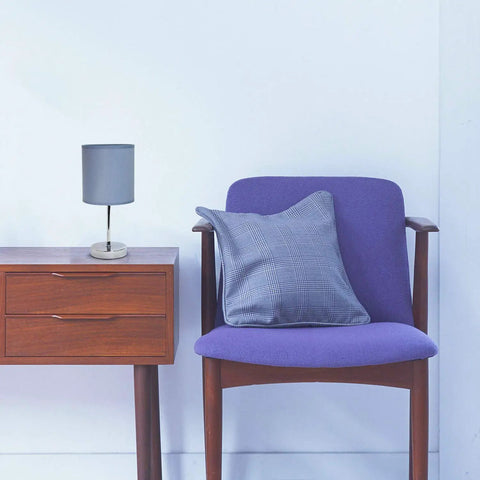 Mini Chrome Base Table Lamp With Fabric Shade In Periwinkle Purple on wooden table next to purple chair, modern decor.