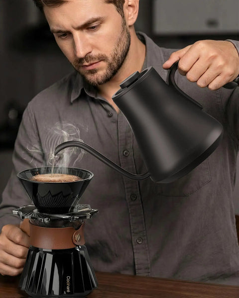 Man using Gooseneck Electric Kettle With 1 Degree Temperature Control 1500W Fast Heating for pour-over coffee brewing.