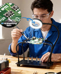 Person using Helping Hands Soldering Station With Four Flexible Arms Five X Magnifying Glass Adjustable Light And Four Magnetic PCB Holders