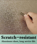 Hand scratching Heavy Duty Fireproof Heat Shield Board For Refrigerators And Stoves Oilproof Kitchen Appliance Panel illustrating durability.