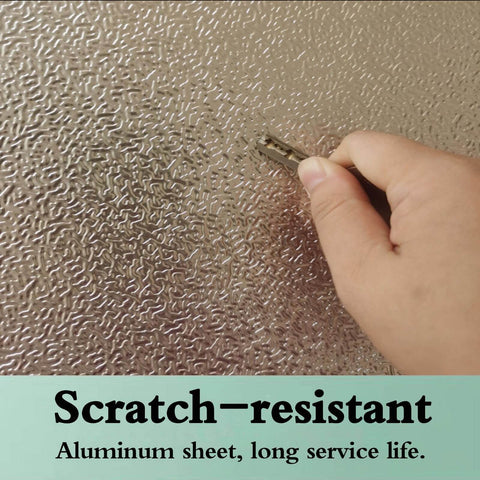 Hand scratching Heavy Duty Fireproof Heat Shield Board For Refrigerators And Stoves Oilproof Kitchen Appliance Panel illustrating durability.