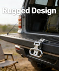 316 stainless steel folding foot pedal with spring-loaded hinge installed on a truck tailgate for boat trailer boarding.
