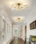 Seven Light Mid Century Modern Flush Mount Ceiling Light With Amber Glass Sputnik Globes Brass Gold Finish for hallway