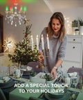 Woman setting holiday table under chandelier with Alexa Compatible E12 Smart Light Bulbs S1 Auto Pairing for quick setup.