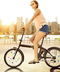 216 Piece Assorted Colors Bike Spoke Beads Clips Set For Wheel Decorations on bicycle wheels in urban setting with cyclist