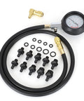 QUNNIE oil pressure tester kit with 0–140 PSI gauge, flexible hose, brass adapters, and numerous black fittings.