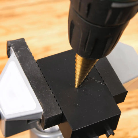 Close-up of a drill using Six Piece High Speed Reaming Pagoda Sawtooth Drill Bit Set With Titanium Plating In Box For Metal
