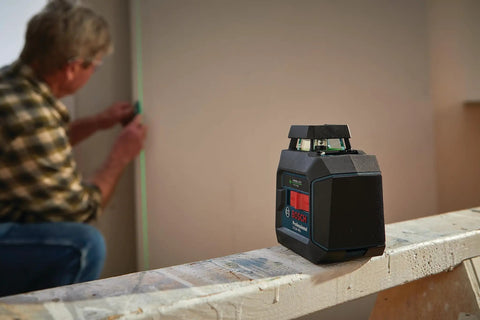 Green Beam Self Leveling 360 Degree Cross Line Laser with Batteries Included L Bracket Ceiling Clip and Hard Carrying Case on table