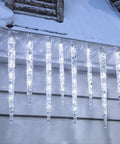 Outdoor Icicle Lights With Clips 20 Ft 100 LED Twinkling White Christmas String Lights, 20 Tubes, hanging on a snowy eave