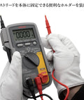 Person holding a High Precision Digital Multimeter Tester for Electrical DIY and Pro Use with probes connected