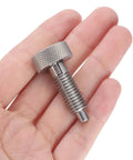 Heavy Duty Spring Plunger Pins In A Two Piece Kit With Knurled Grips And M10x1.5 Threads, shown in hand for scale.