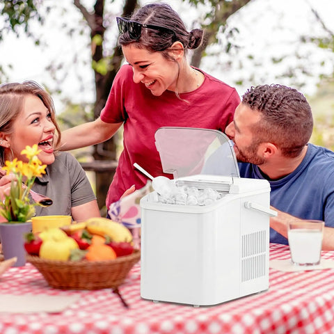 Grab And Go Countertop Ice Maker With Handle Portable Ice Machine at picnic with basket and scoop on a red checkered table