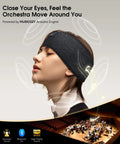 Woman wearing all-in-one Bluetooth sleep headband with HD stereo speakers and eye mask, background shows orchestra.