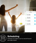 Apple HomeKit Smart Dimmer Switch KS220P3 app showing scheduling feature on smartphone with woman and child in background.