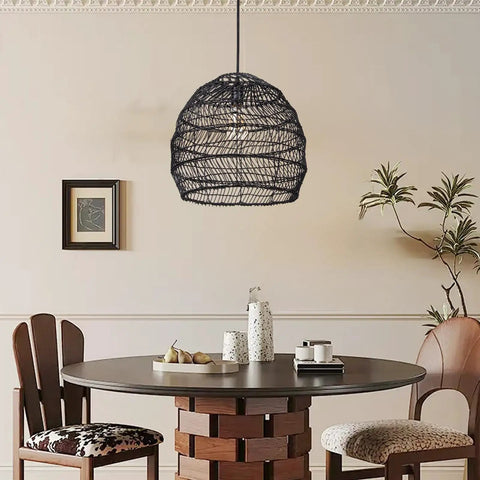 Dining room with One Light Rattan Woven Pendant Lamp In Black Finish, handmade rattan shade above round table, cozy setting