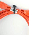 Gardner Bender Push Mount Bases One Quarter Inch Hole Nylon 6/6 Black UV Resistant Cable Clips holding orange power cables securely.