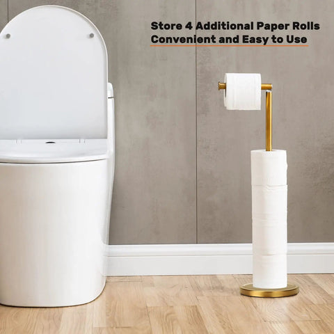 Gold Freestanding Toilet Paper Holder With Heavy Marble Base beside white toilet in bathroom