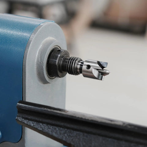 Close-up of a Four Prong Spring Loaded Spur Drive Center 2MT on a wood lathe with strong 1 inch grip and sharp spurs.