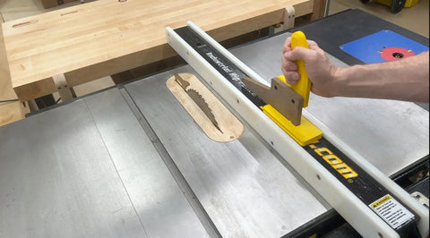 SavR Push Block For Table Saw And Router Table, With Magnetic Fence Mount guiding wood past blade on table saw