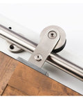 Heavy Duty Sliding Barn Door Hardware Kit In Brushed Stainless Steel showcasing smooth glide roller mechanism and wooden door edge.