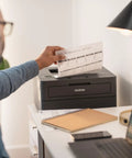 Compact Wireless Monochrome Laser Printer With Mobile Printing And Alexa Compatibility For WFH Home Offices Black And White Output Up To 30 Pages Per Minute Includes Refresh Subscription Trial on desk