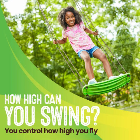 Child playing on Stand Up Tree Swing For Kids With Adjustable Handles, Surf Style Kick Swing, Easy Install Outdoor Swingset, Green