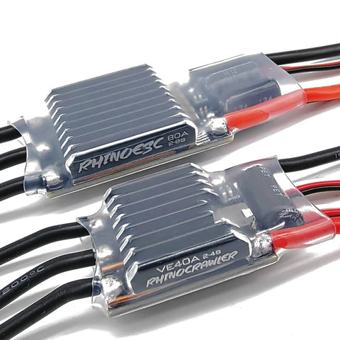 AM32 40A Crawler ESC With 5.2 To 8.2V BEC, two units with metallic casing, connected wires visible, for precise control on rock crawlers.