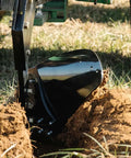 Close-up of Three Point 21 Inch Double Moldboard Turn Plow for Category 1 Tractors, breaking soil, dual blades visible.