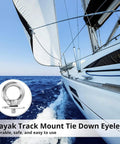 Sailboat using 6 Pack Track Mount Beefy Tie Down Eyelets Stainless Steel Eye Bolt Anchor Kit for secure anchoring on ocean.
