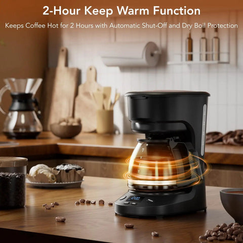 Compact 5 Cup Drip Coffee Maker With Programmable Timer, Two Hour Auto Power Off, Black coffee machine on kitchen counter