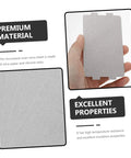 Hand holding a sheet from 10 Pack Mica Sheet Insulation For Microwave Ovens, Heat Resistant Replacement Plates with text highlighting features.